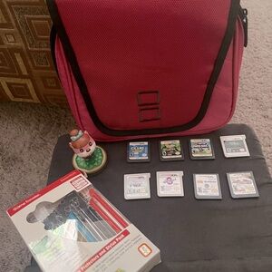 Nintendo 3DS XL games, stylus, and carrying case/bag